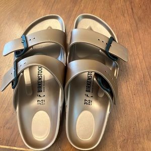 Bronze Birkenstocks. Never worn perfect condition.